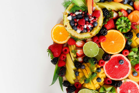 A vibrant fruit basket bursting with colour and probably flavour too!