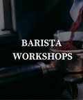 text stating "Barista Workshops" over an image of coffee grinding into a portafilter. 