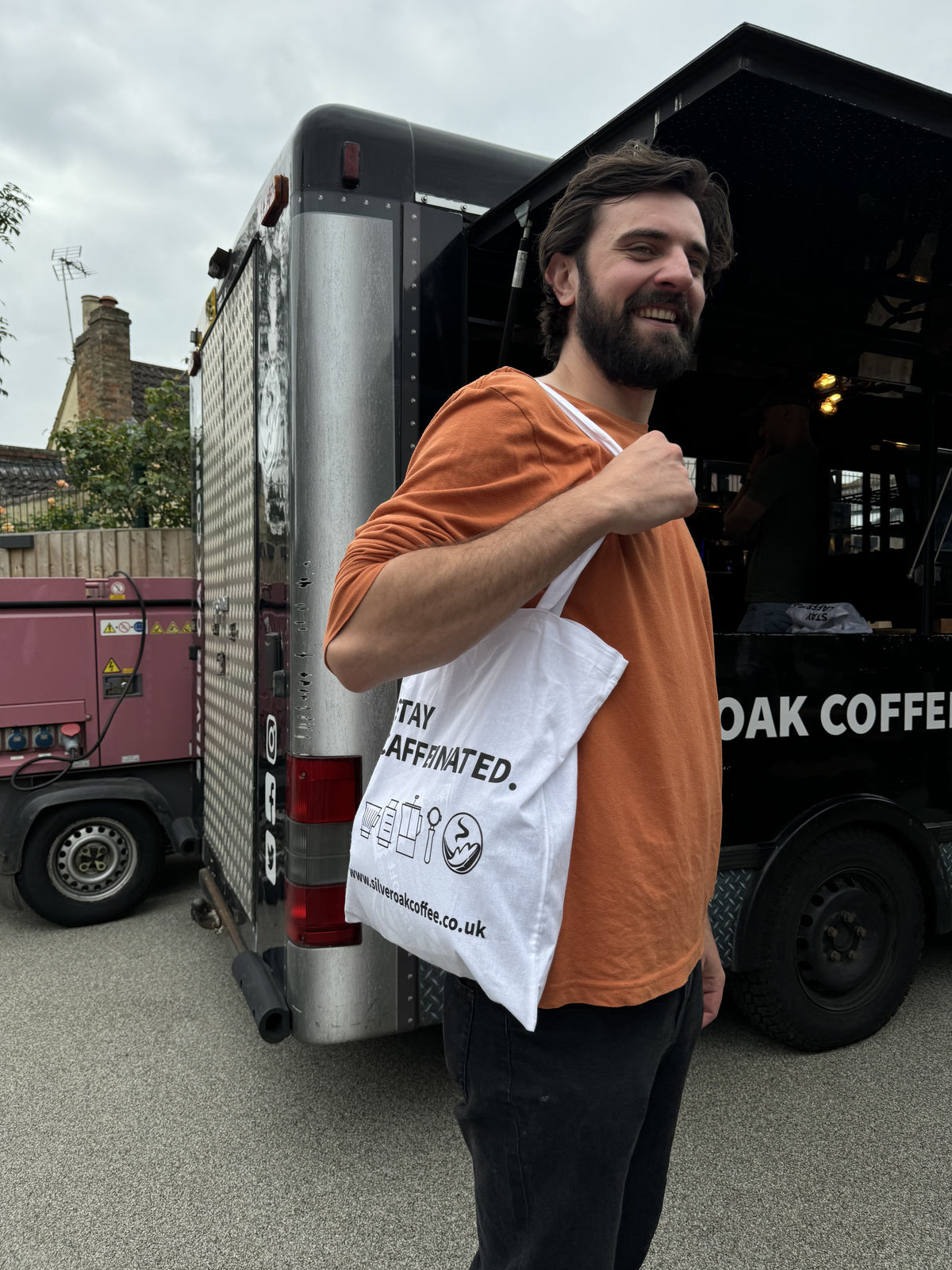 customers at the silver oak end of summer coffee fest 2024. This guy is sporting a silver oak tote bag