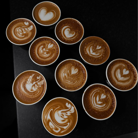 10 flat whites all with differing latte art designs