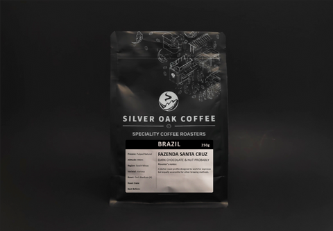 A photo showcasing a bag of coffee beans from Fazenda Sana Cruz farm, Brazil, with notes of dark chocolate & nut.
