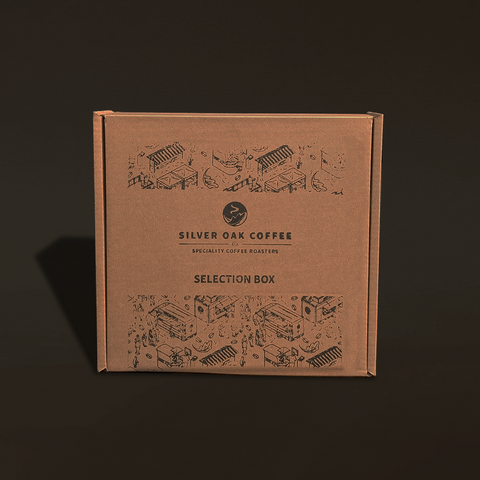Brown cardboard box with 'Silver Oak Coffee' branding on a dark background